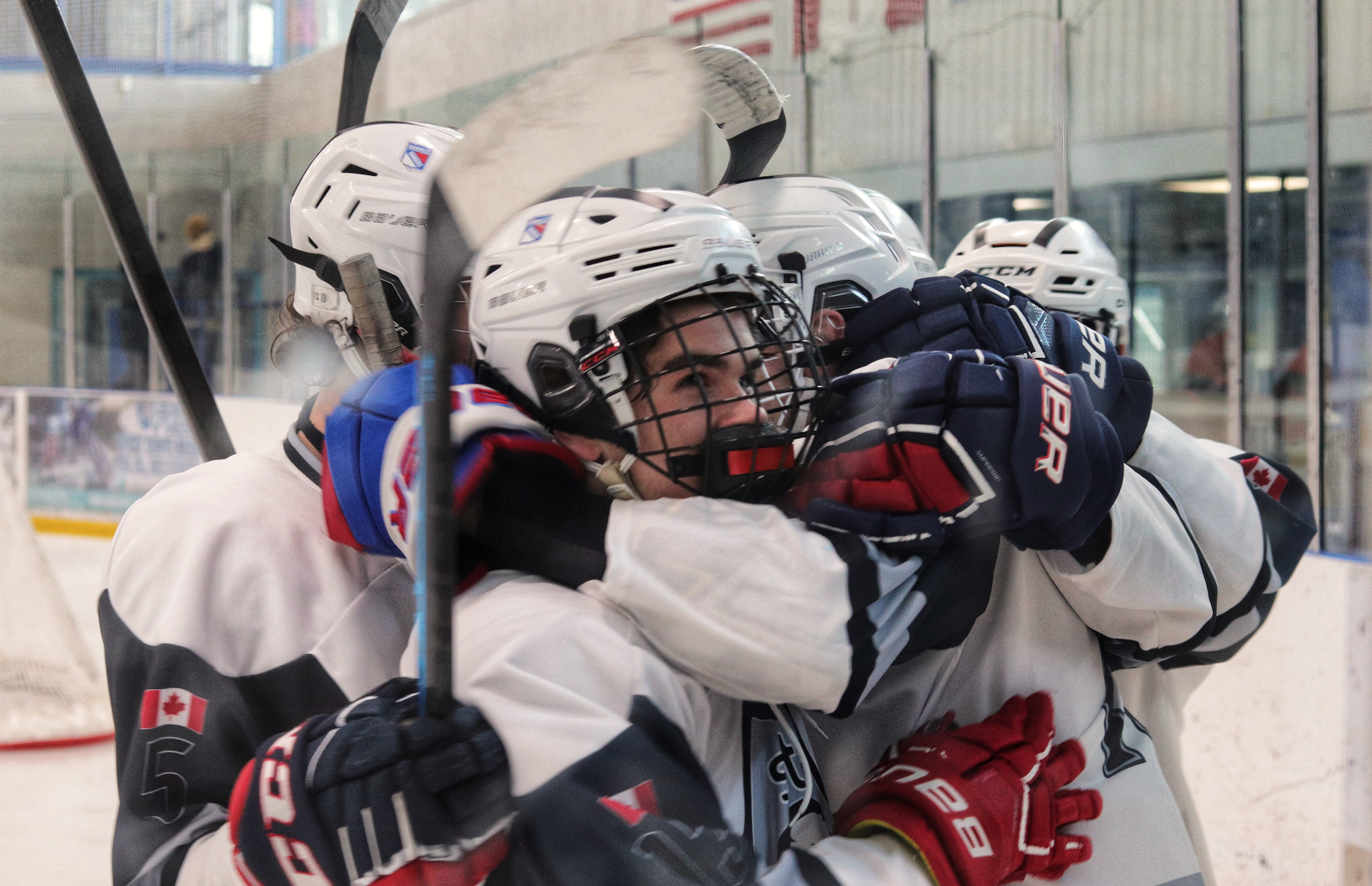Aquinas players swarm after tying the game up for a second time. | Robby Gray ties the game for a second time, only moments after Bishop Redding took the lead in the second period. | Pierce Lang